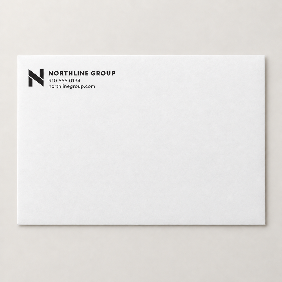 One-color A7 business announcement envelope with logo and contact information in the upper-left